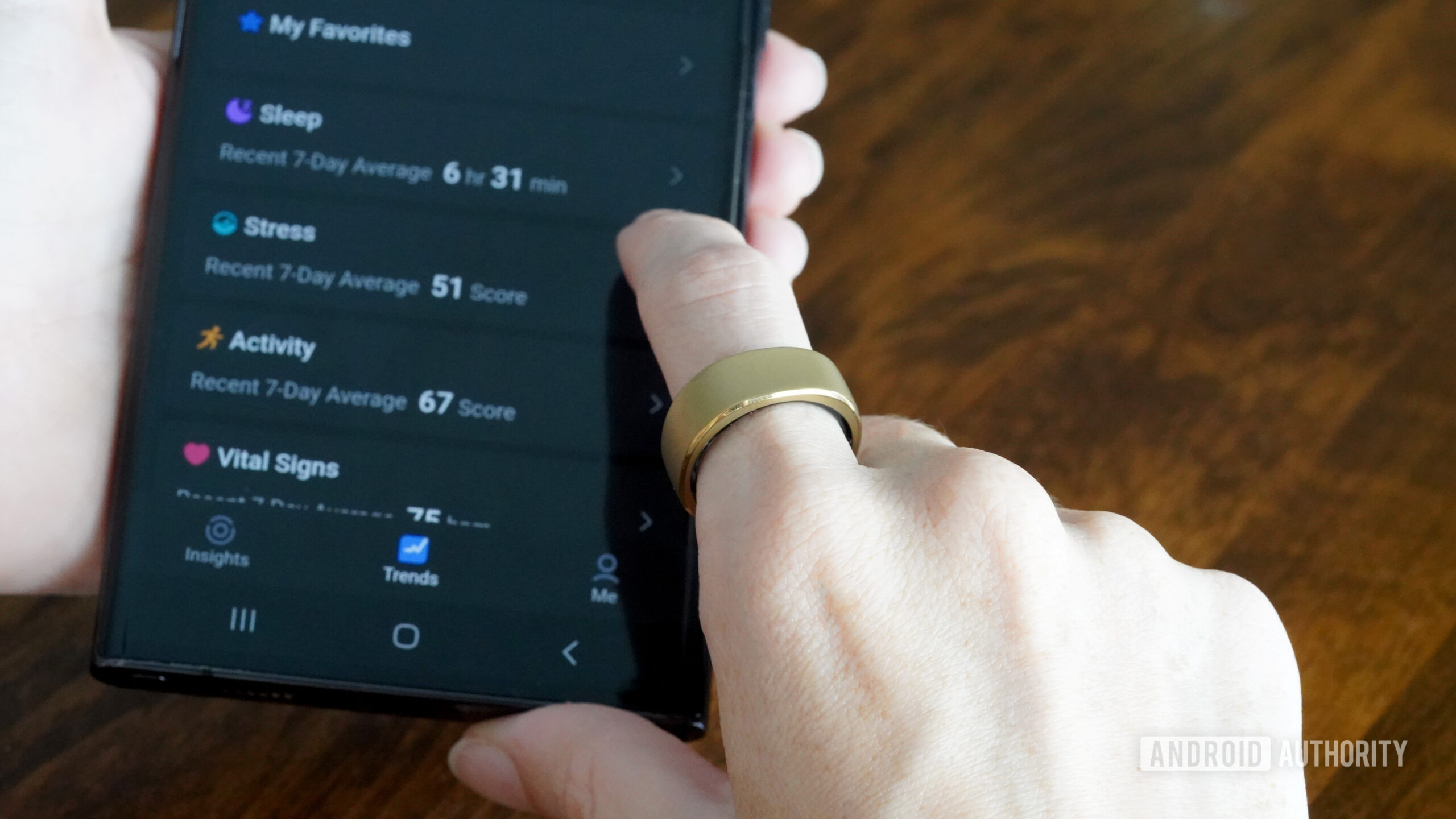 A RingConn Smart Ring user swipes through their data in the device's companion app.