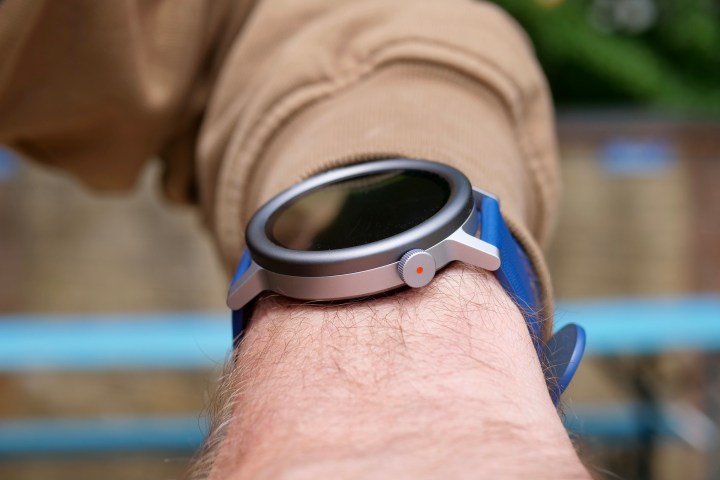 A person wearing the CMF Watch Pro 2, showing the crown.